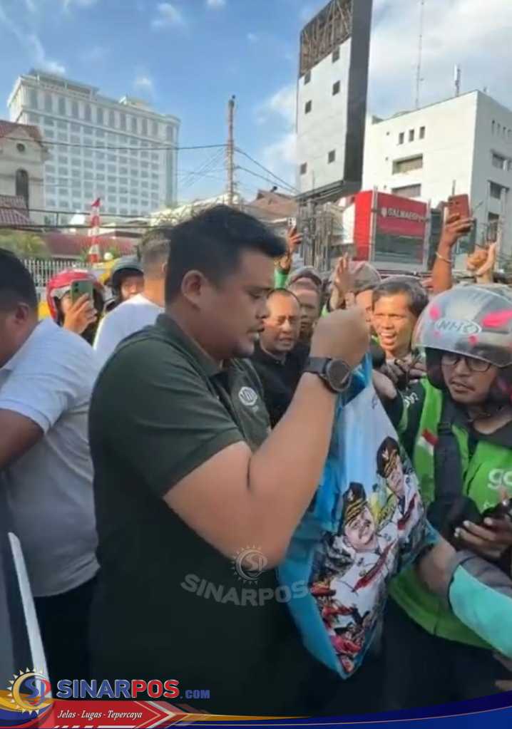 Gubsu Bobby Nasution Bagikan Paket Sembako Ke Driver Ojol di Medan